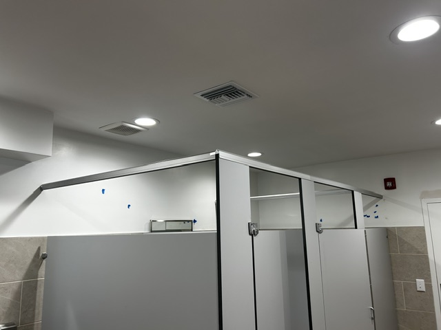 Finished commercial restroom ceiling and wall work
